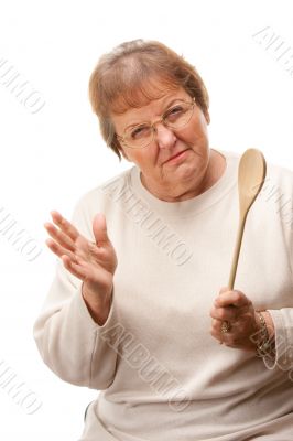 Upset Senior Woman with The Wooden Spoon