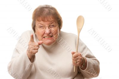 Upset Senior Woman with The Wooden Spoon
