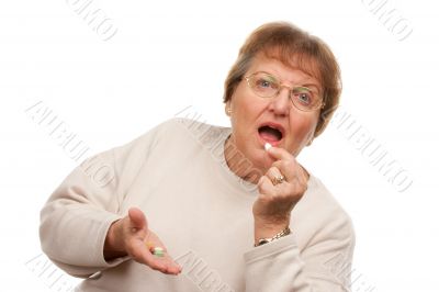Attractive Senior Woman Taking Pills
