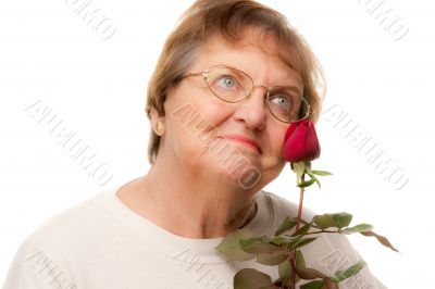 Attractive Senior Woman with Red Rose
