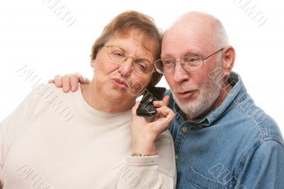 Happy Senior Couple Using Cell Phone