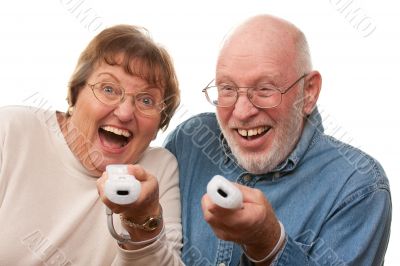 Happy Senior Couple Play Video Game with Remotes