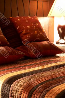Colorful cushions on the bed