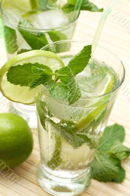 Two mojito cocktails with lime
