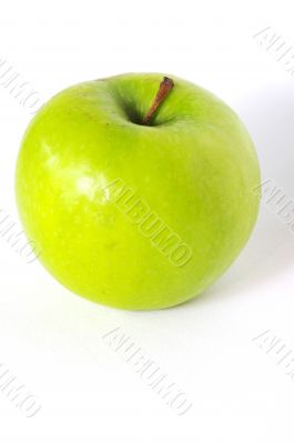 Green apple on the white background