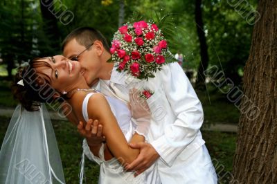 Groom kissing bride