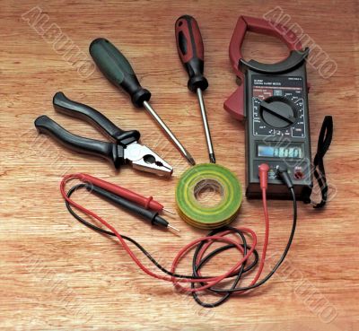 Electrician tools on wooden surface
