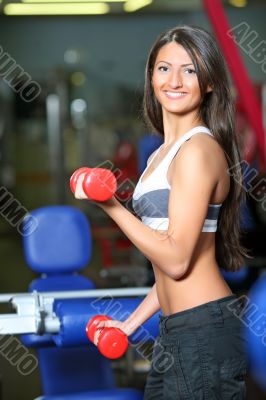 The girl with dumbbells The girl with dumbbells