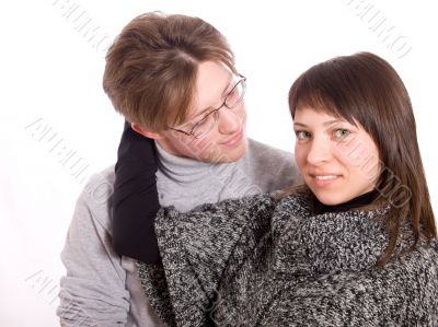 The young girl embraces the man