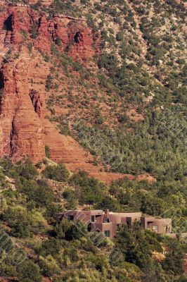 Arizona red rock canyon with buildings nestled in trees