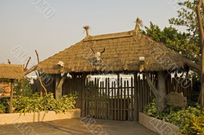 Gated entrance with thatch roof