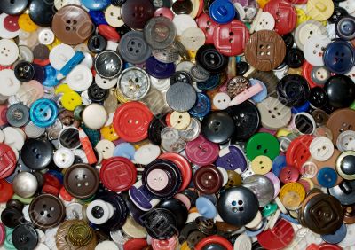 Multicolored plastic and metal button background