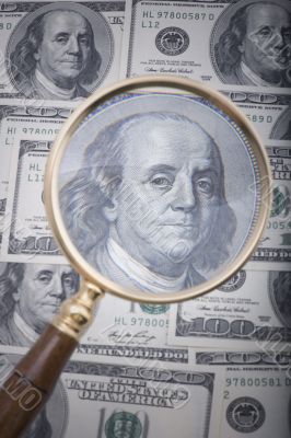magnifier with money close up