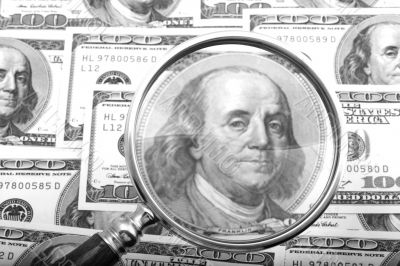 magnifier with money closeup