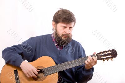 The man playing on guitar