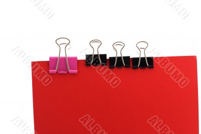 Paper clips on a red background