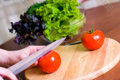 cook cuts tomato