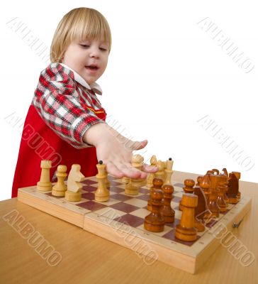 Small girl play chess