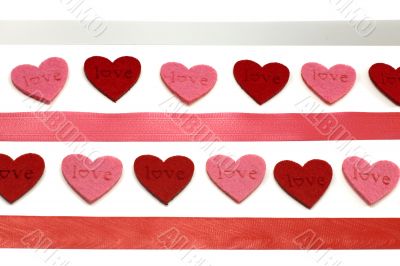 A lot of red and pink hearts with colours ribbons