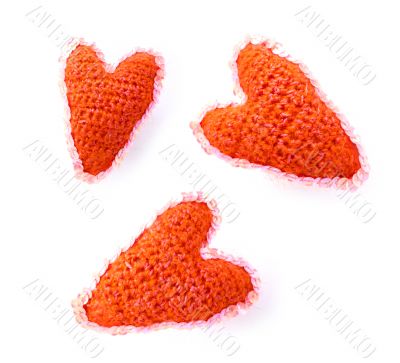 three woollen red hearts