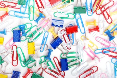 Multicolored paper clips and thumbtacks Multicolored paper clips and thumbtacks