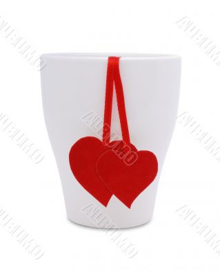A cup with two red hearts