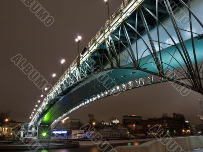 Highlighted bridge over the river at night