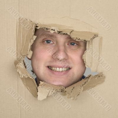 Male face in hole carton