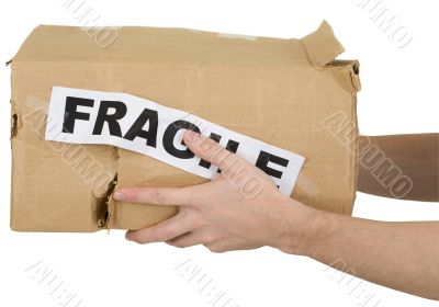 Crumpled cardboard box with inscription `fragile`
