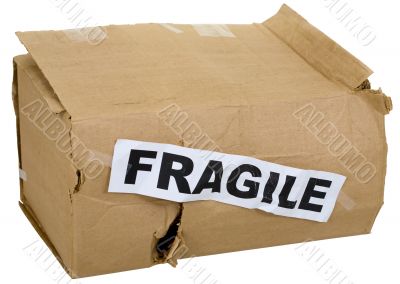 Crumpled cardboard box with inscription `fragile`