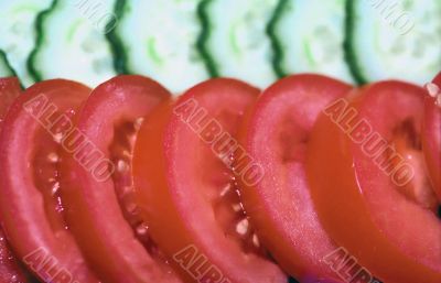 Tomatoes and cucumbers background Tomatoes and cucumbers background