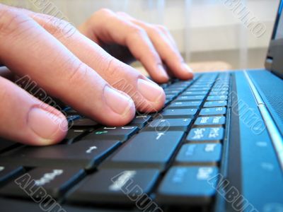 computer keyboard with human hand