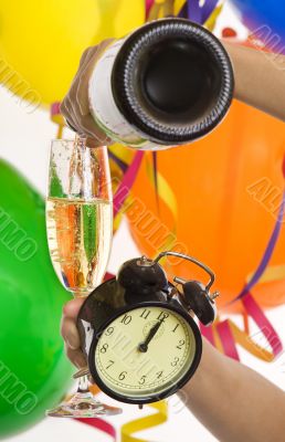 Turn of the year, New Year with champagne and clock Turn of the year, New Year with champagne and clock