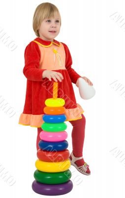 Little girl and toy pyramid
