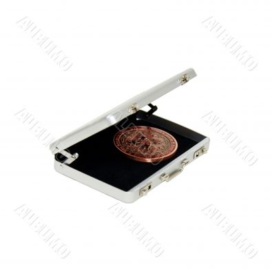 Intricate coin in silver briefcase Intricate coin in silver briefcase