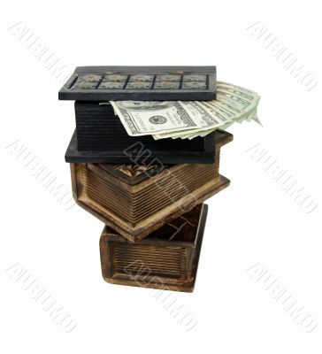 Stack of money in wooden books