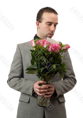 Man Smelling Roses