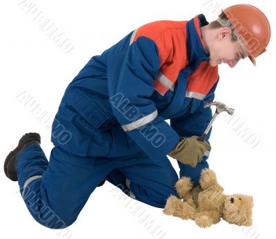 Man with hammer and toy bear