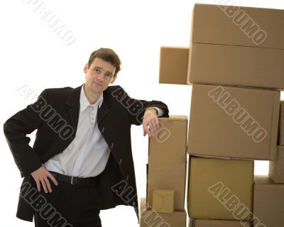 Man lean one`s elbows on cardboard boxes