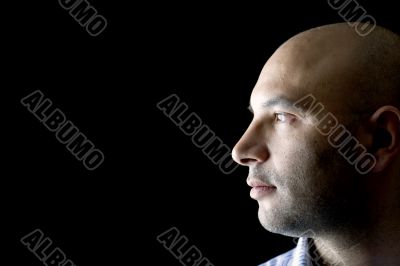 Man on black close up