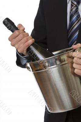 Man with suit champagne bottle in ice-pail