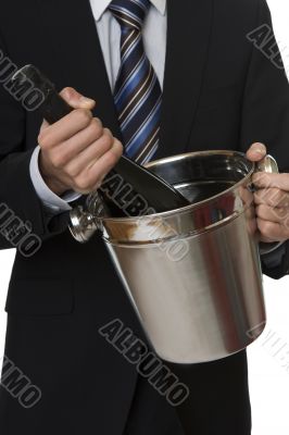 Man with suit champagne bottle in ice-pail