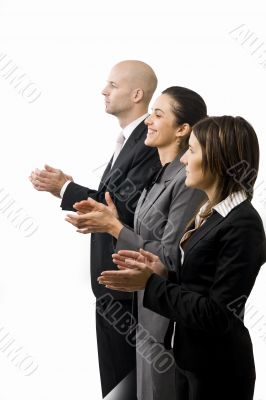 Businesspeople in a row clapping