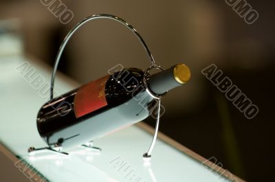 Bottle of wine in a holder Bottle of wine in a holder