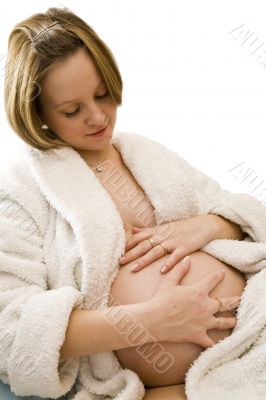 pregnant woman holding her belly