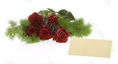 red roses with a cream-colored place card
