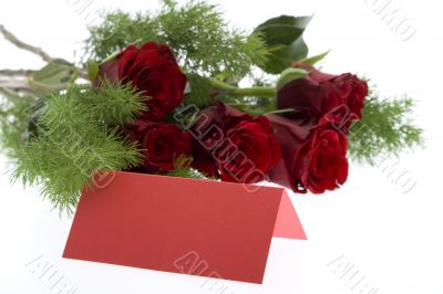 red roses with a red place card red roses with a red place card