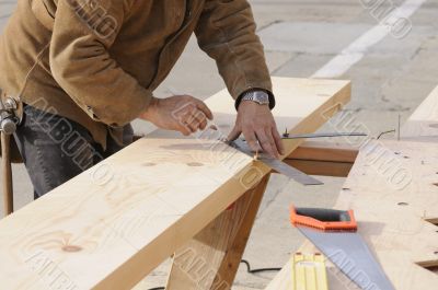 Carpenter marking out steps on a stringer