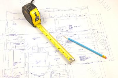 Building plans and tape measure