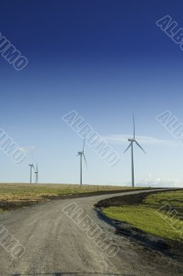 Wind generators at the end of a dirt road